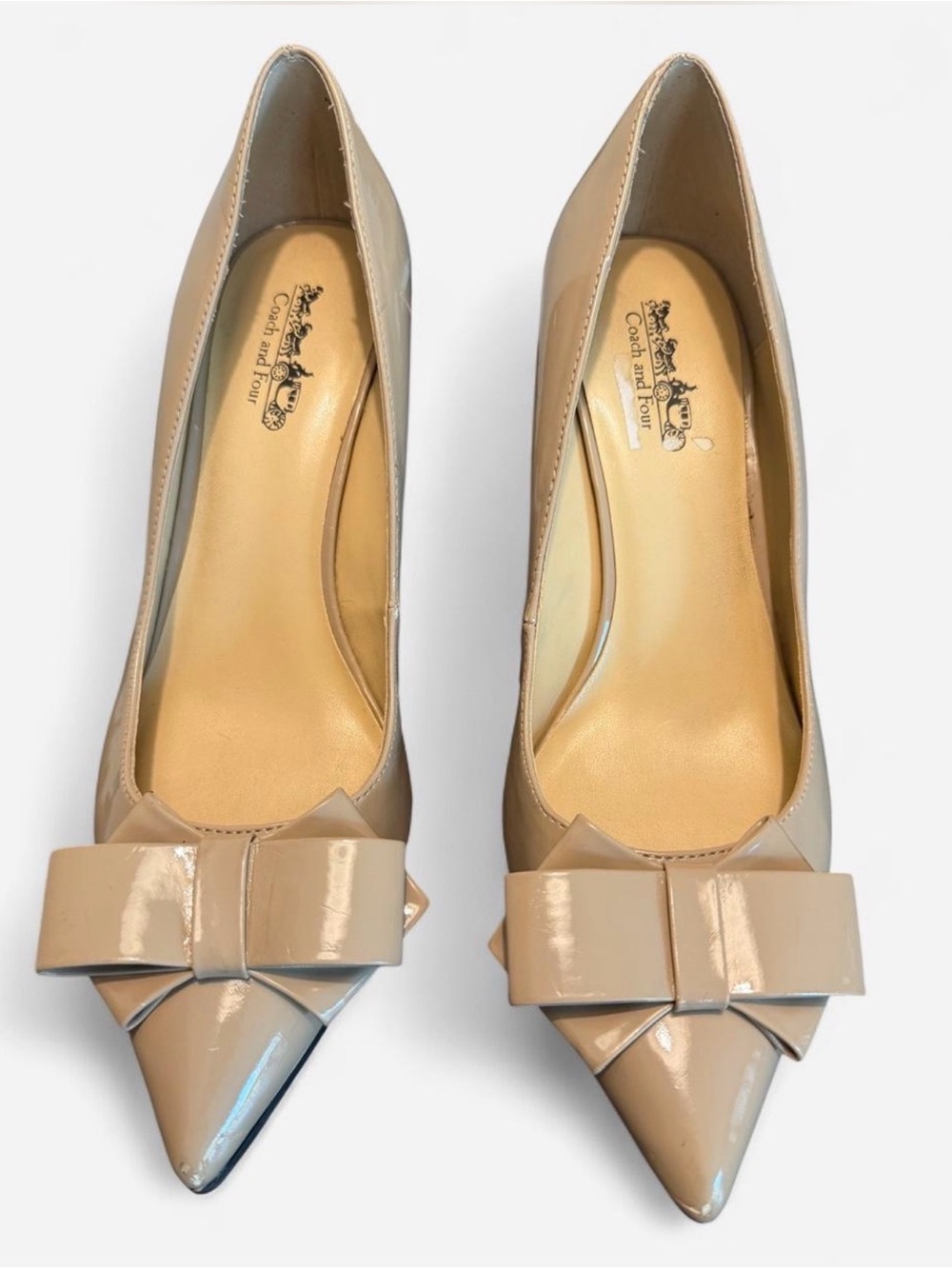 Coach and Four Nude Patent Leather Pointed-Toe Pumps with Bow